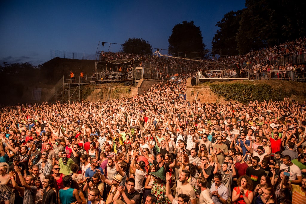 A large crowd watching live music