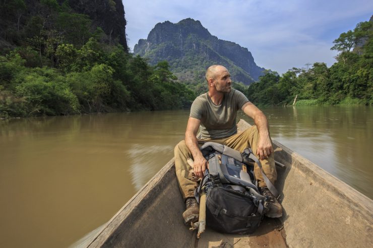 Ed Stafford on a long tail boat in southern Laos.