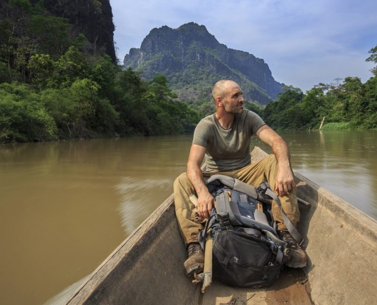 Ed Stafford on a long tail boat in southern Laos.
