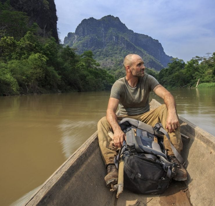 Ed Stafford on a long tail boat in southern Laos.