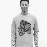 Model wearing a grey Enable8 jumper