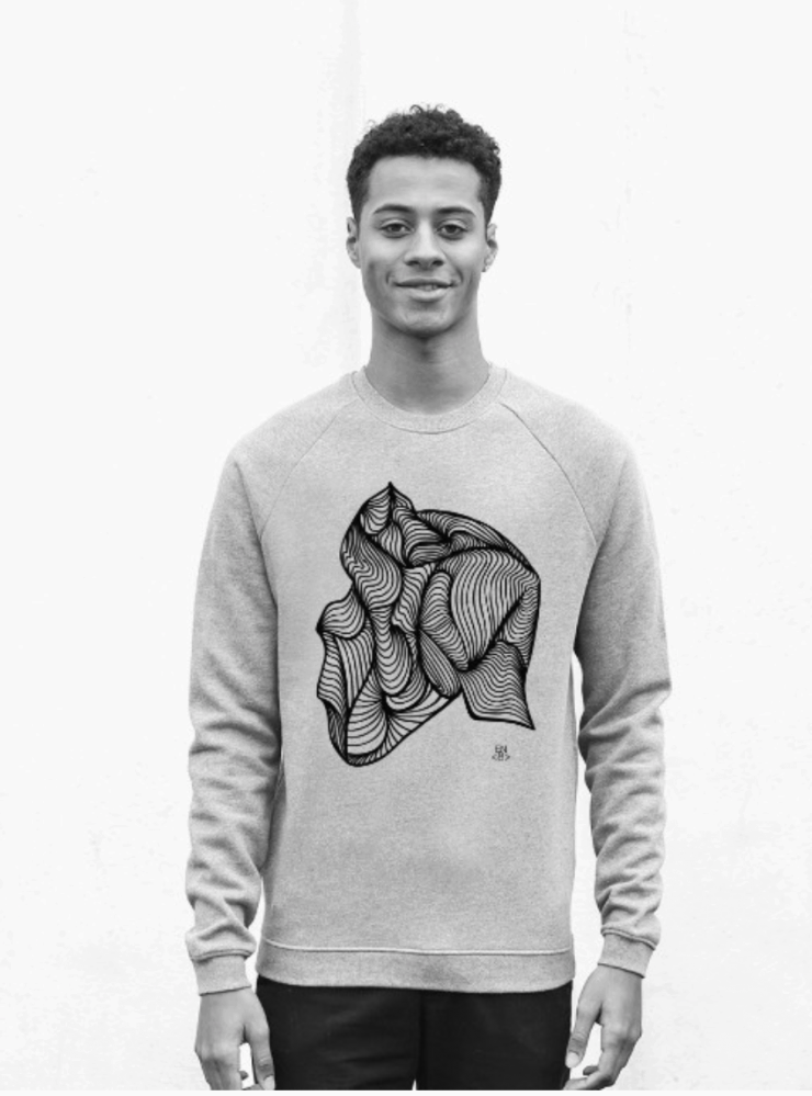 Model wearing a grey Enable8 jumper