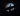 A man walking with a surfboard in the moonlight