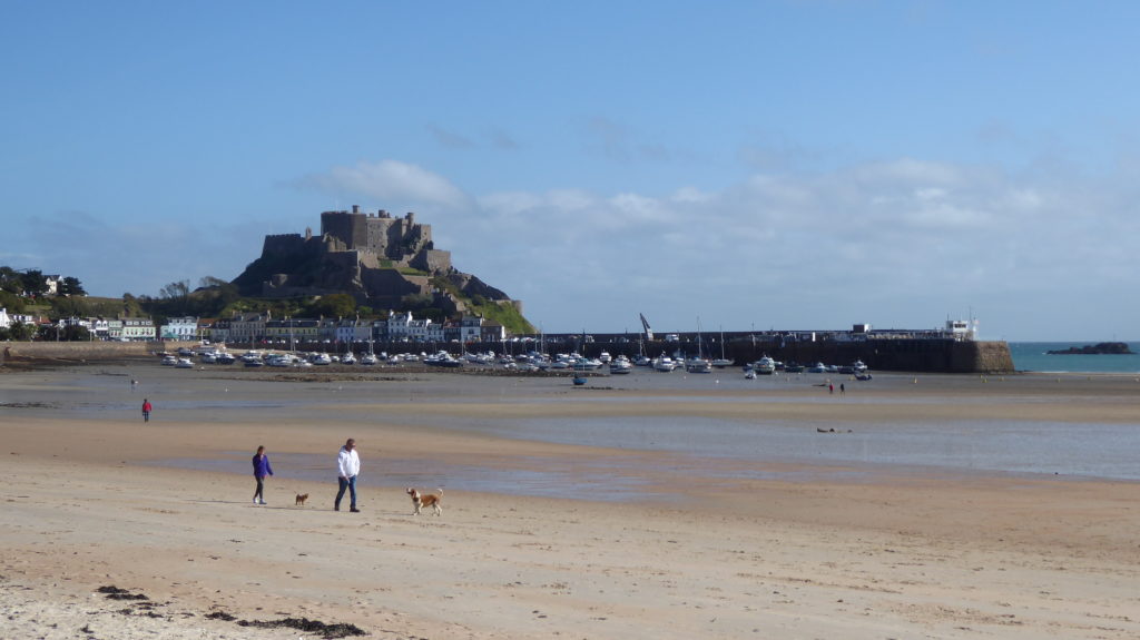 Gorey Harbour in Jersey viewed from the beach with Mont Orgueil Castle in the background