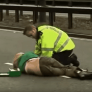 Ursula Eriksson being tended to by a policeman