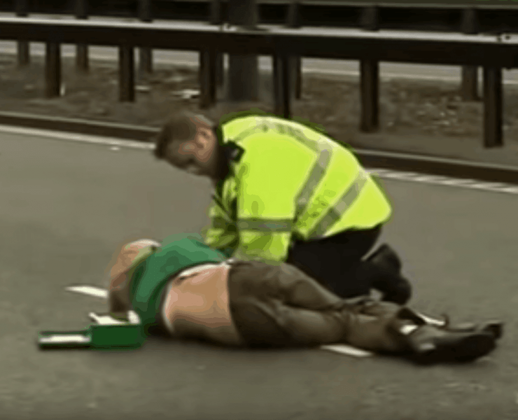 Ursula Eriksson being tended to by a policeman