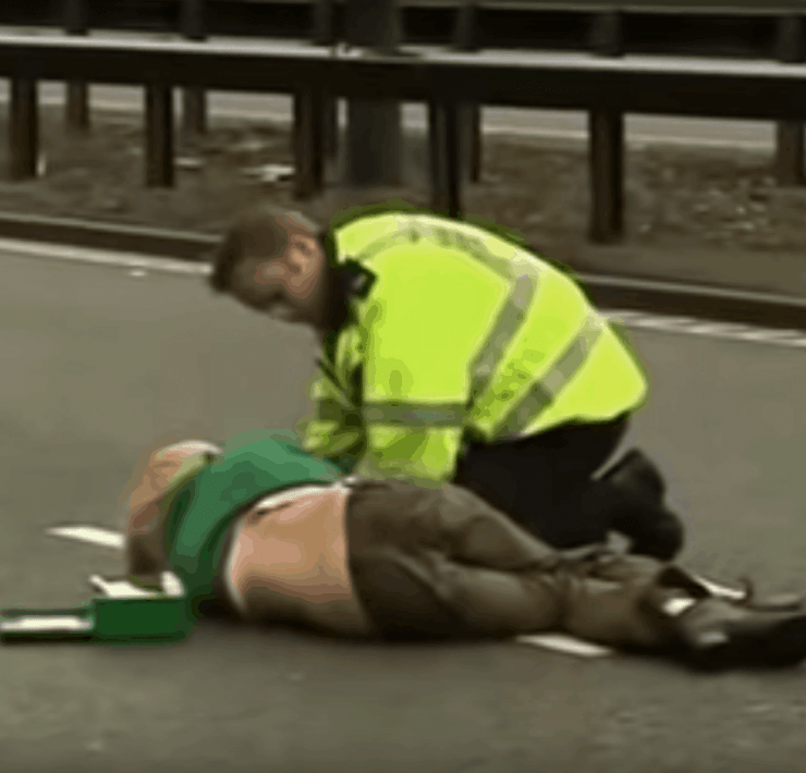 Ursula Eriksson being tended to by a policeman