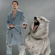 David Bowie with a wolf on a leash
