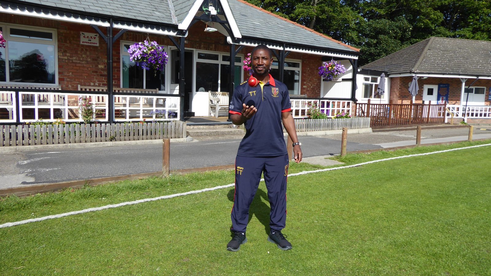 Tatenda Taibu throwing a cricket ball in the air outside Formby CC. © The MALESTROM / James Johnson