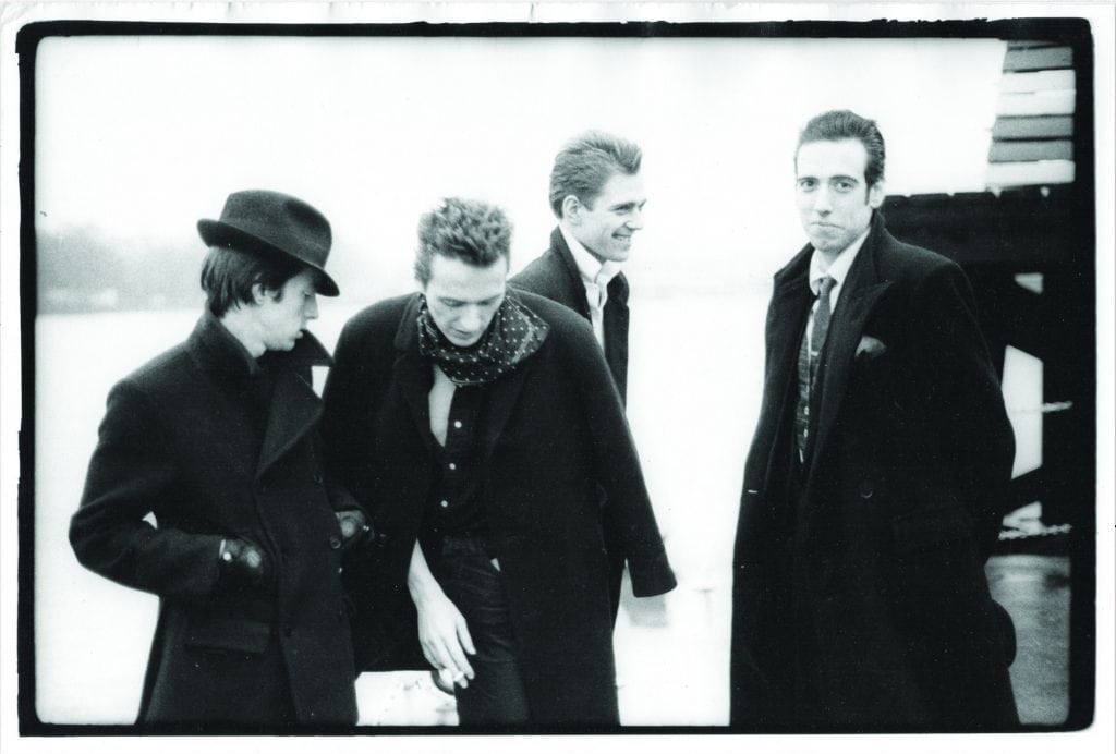The Clash At the London Calling video shoot, on the River Thames, 1979. Credit: Pennie Smith