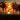 Sunset on a beach with palm trees in the foreground