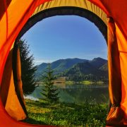 A mountain view from the door of a tent