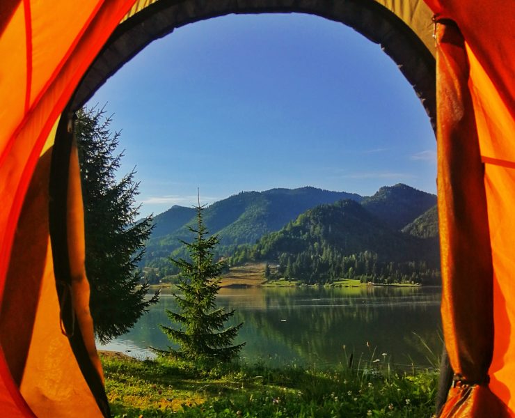 A mountain view from the door of a tent