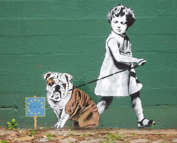 EU graffiti - child trying to lead a bulldog away from eu flag